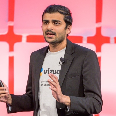 Dr. Raj Dandekar speaking on stage